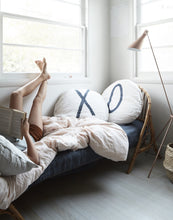 Round Chalk Pillow with "X"